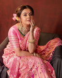 Traditional Beauty: A Woman's Grace in a Vibrant Pink Silk Saree