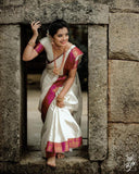Elegant White Kanjivaram Saree with Contrasting Pink Border