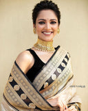 Lustrous Cream Kanjivaram Saree in Soft Silk with Striking Matching Border